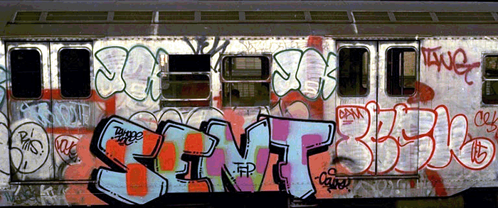 Dope shot from the classic 80s subway train era of graffiti in New York. Some work by SENTO TFP, TESK U5, and king JA XTC. A throwie by the legendary CRO RIS in the cut to the left of SENTO.